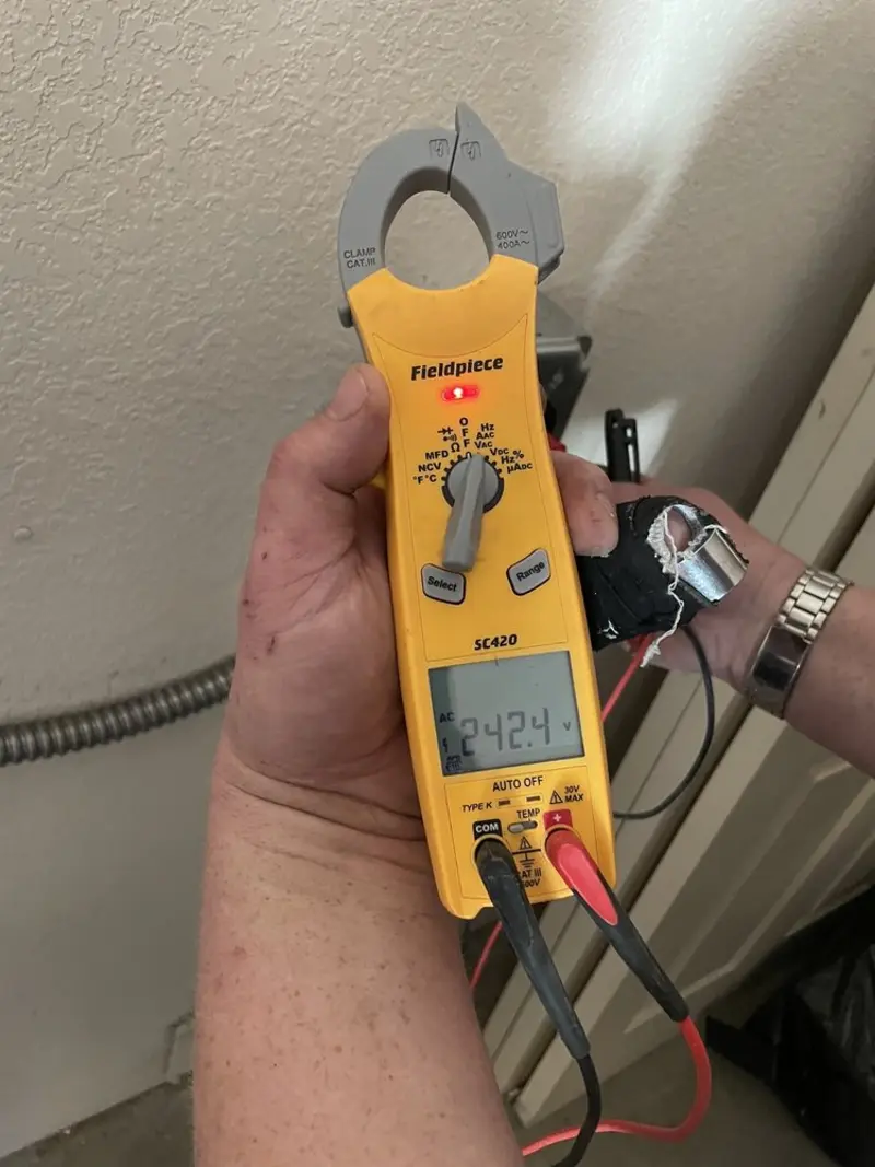 Voltage testing with clamp meter during Electrical Installation Services in West Bradenton